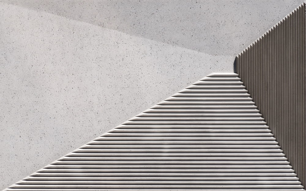 gray concrete stairs with white wall