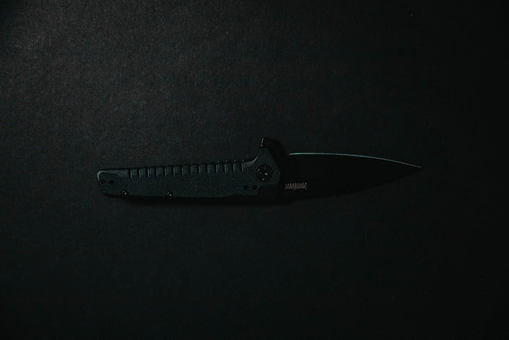 black knife on black textile
