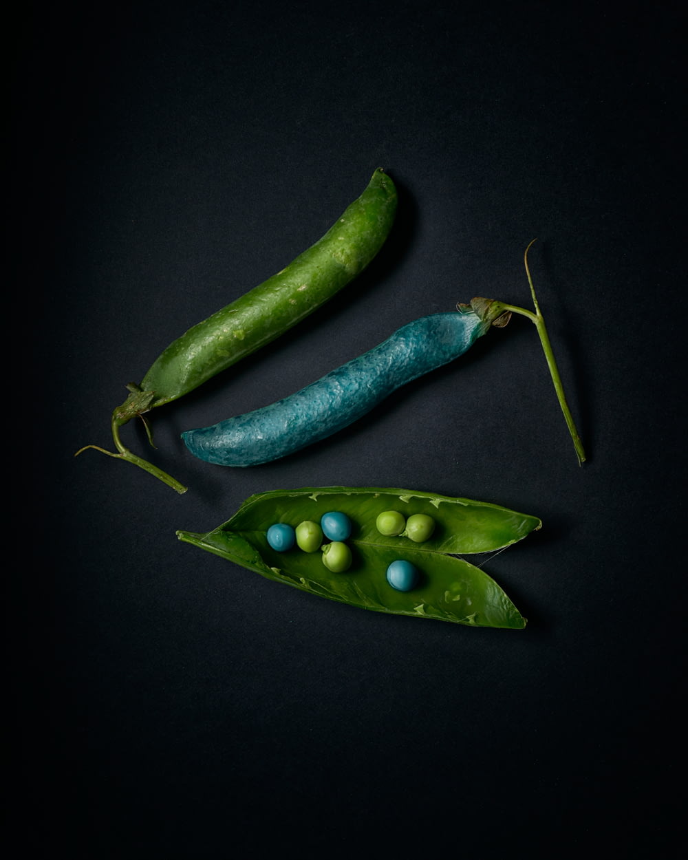 green chili pepper on black surface