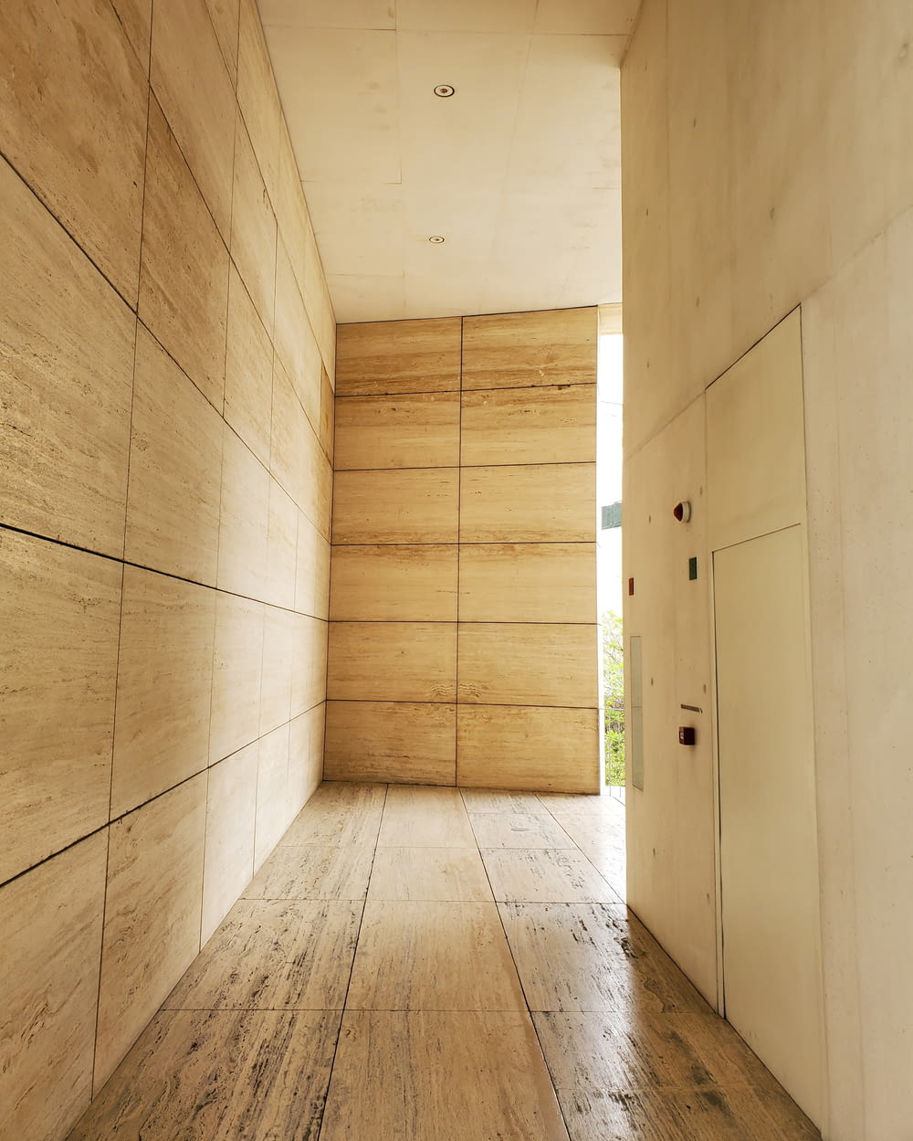 brown wooden parquet floor with white wooden doors