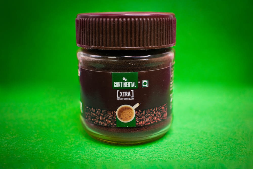 black and brown labeled jar
