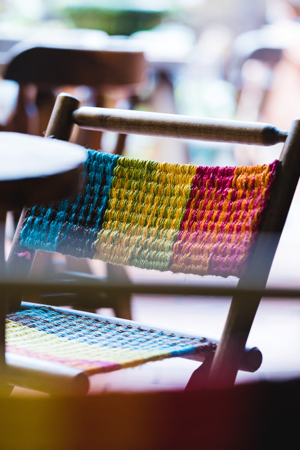 multi colored knit textile on brown wooden table