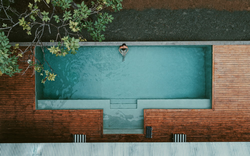 person in swimming pool during daytime