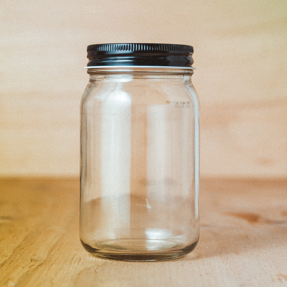 clear glass jar with white powder inside