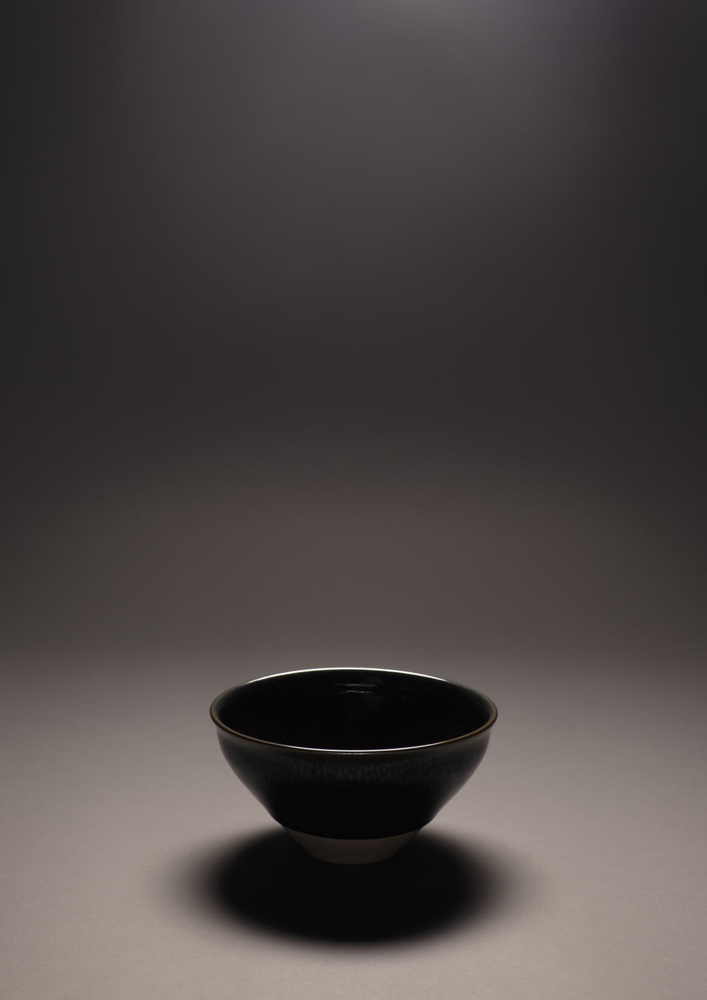 black ceramic bowl on white table