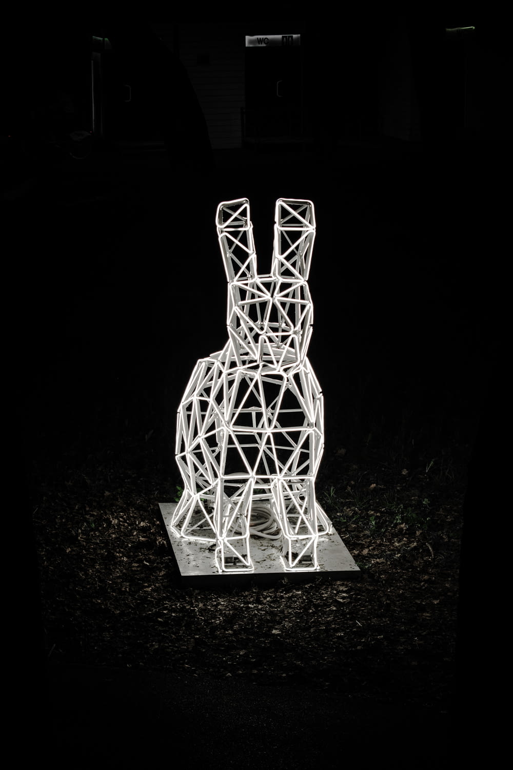a sculpture of a rabbit in the dark