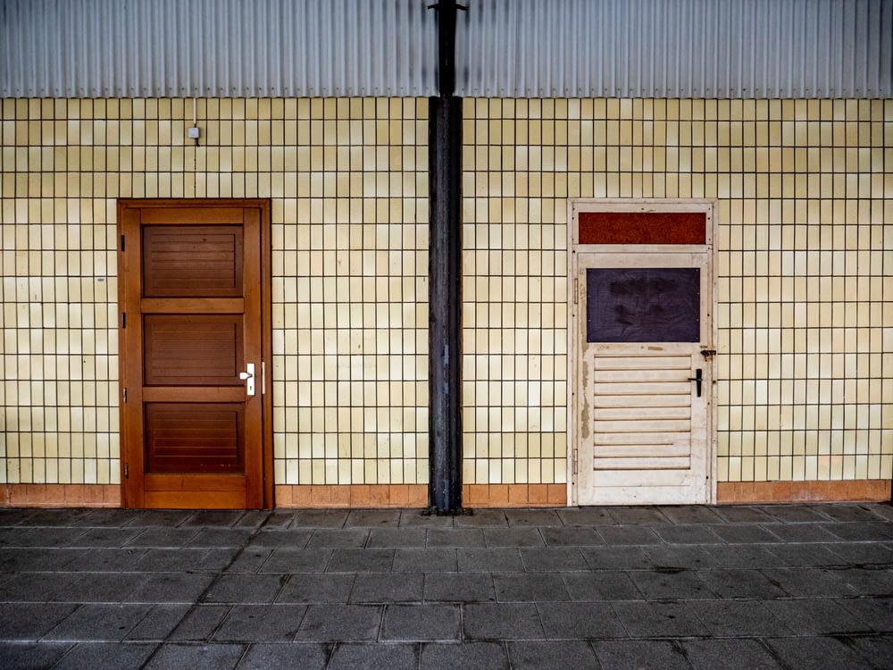 brown wooden door beside brown wooden door