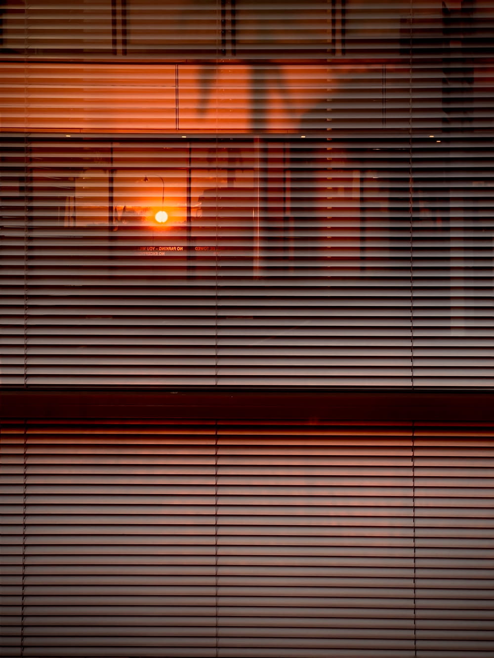 white window blinds during sunset