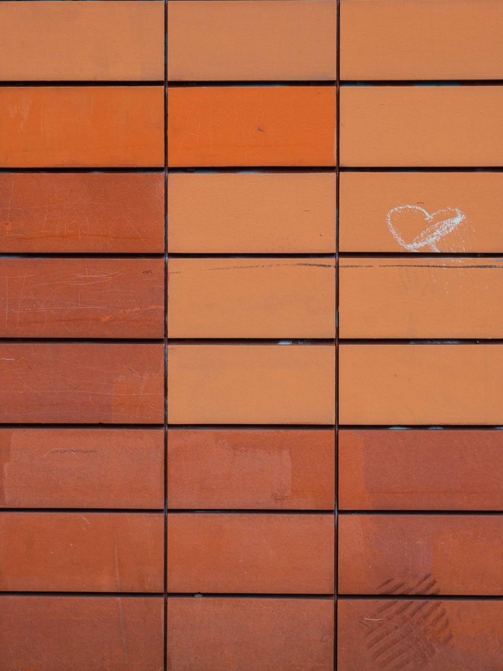 brown brick wall with white heart print