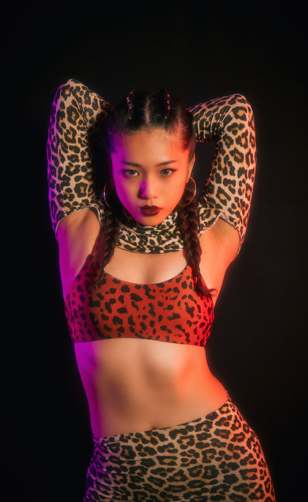 woman in red and black leopard print brassiere