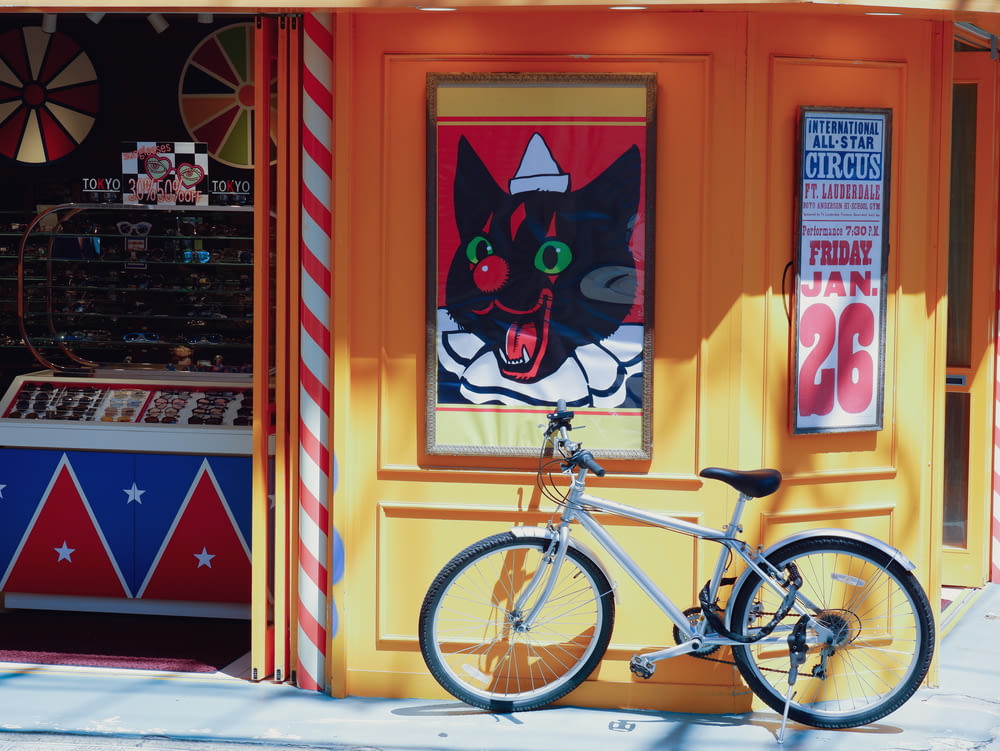 a bicycle is parked in front of a store