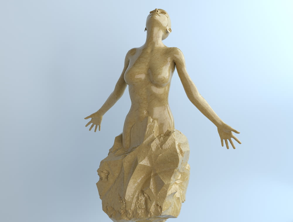 woman in dress statue during daytime