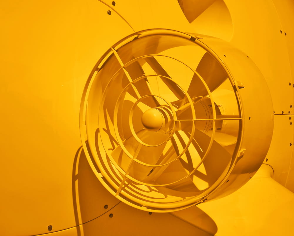 yellow and white wall fan