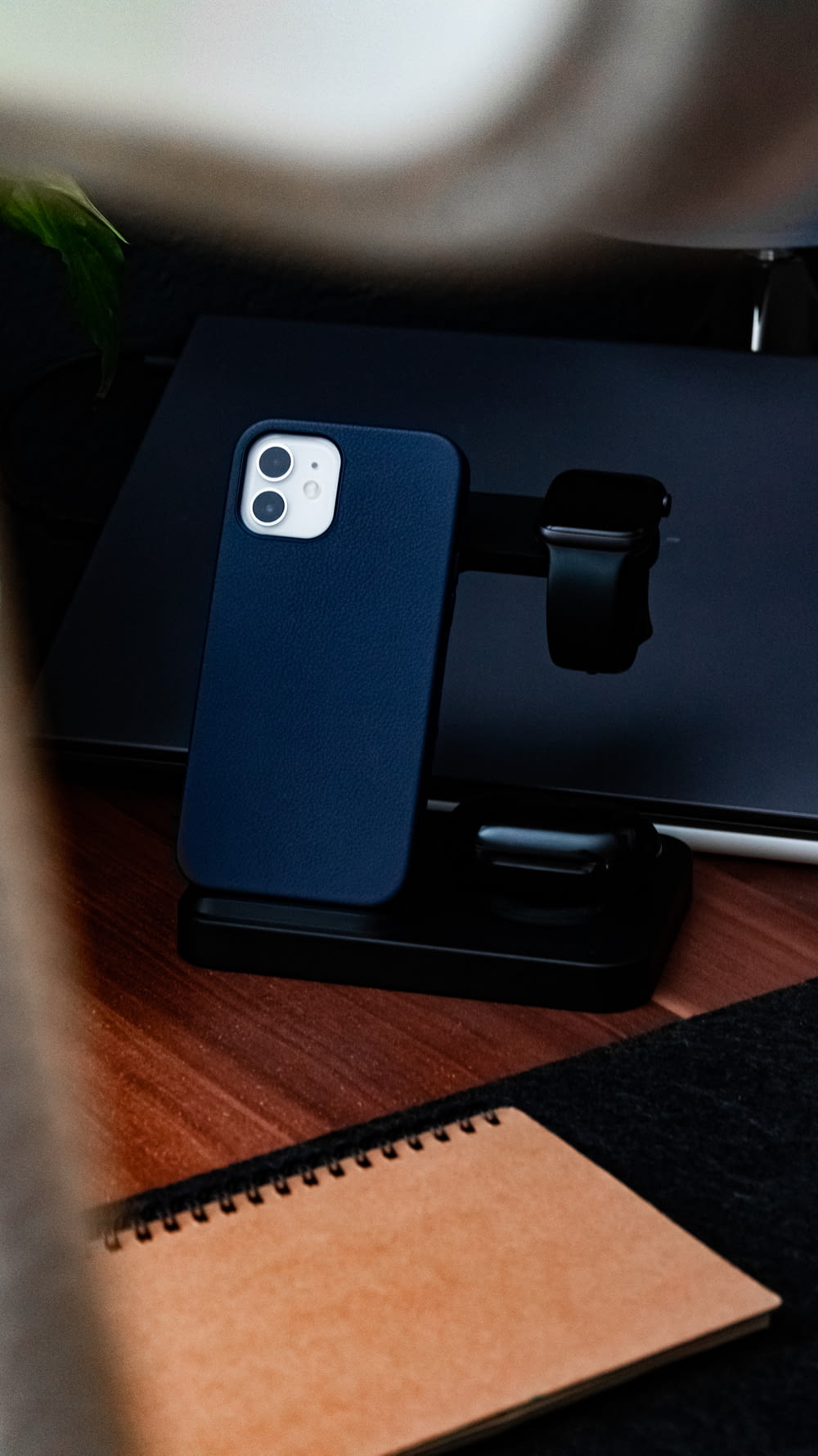 blue iphone case on black ipad