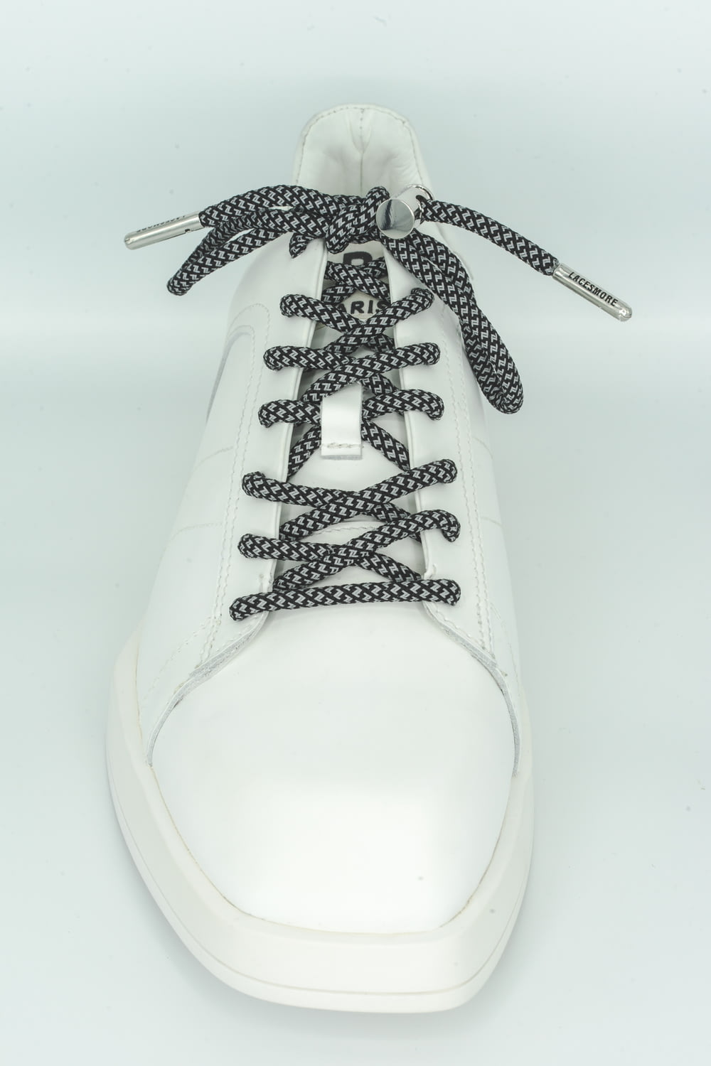white and black lace up shoe