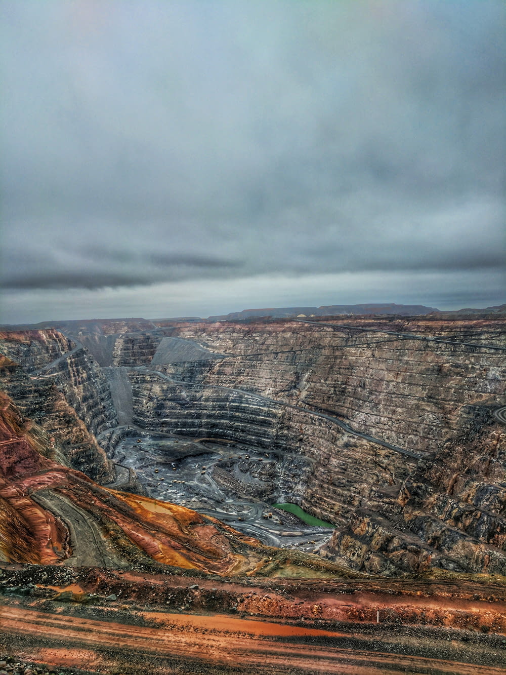a view of a large open pit in the middle of nowhere
