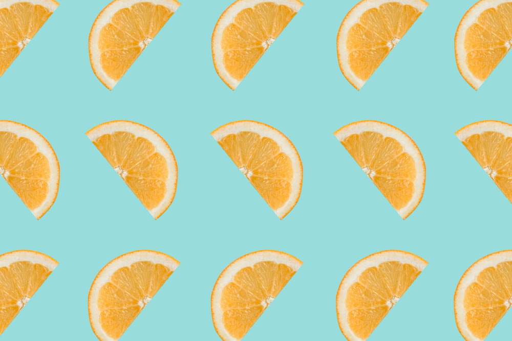 sliced orange fruits on white background