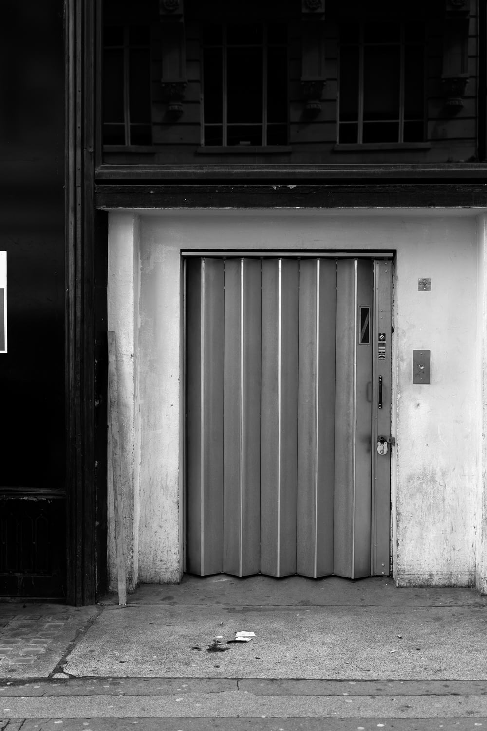 grayscale photo of closed door