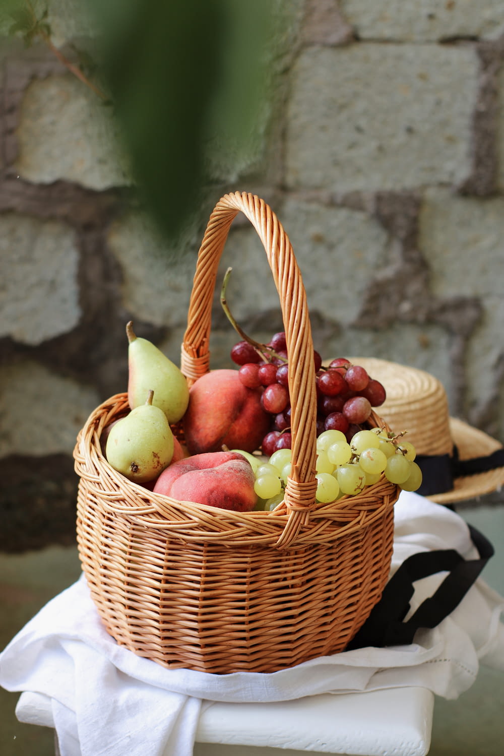 red apples in brown woven basket