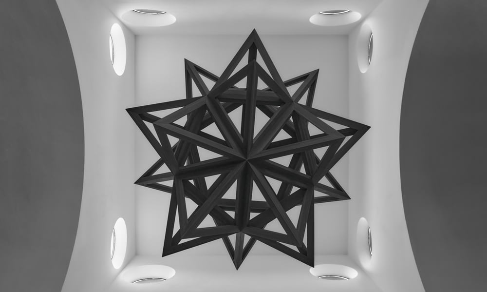 Decoración de pared de estrella de madera en blanco y negro