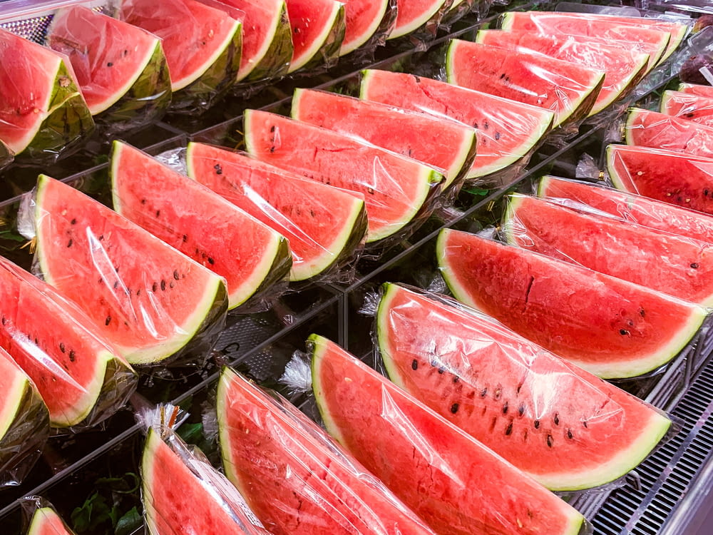 sliced watermelon on stainless steel tray