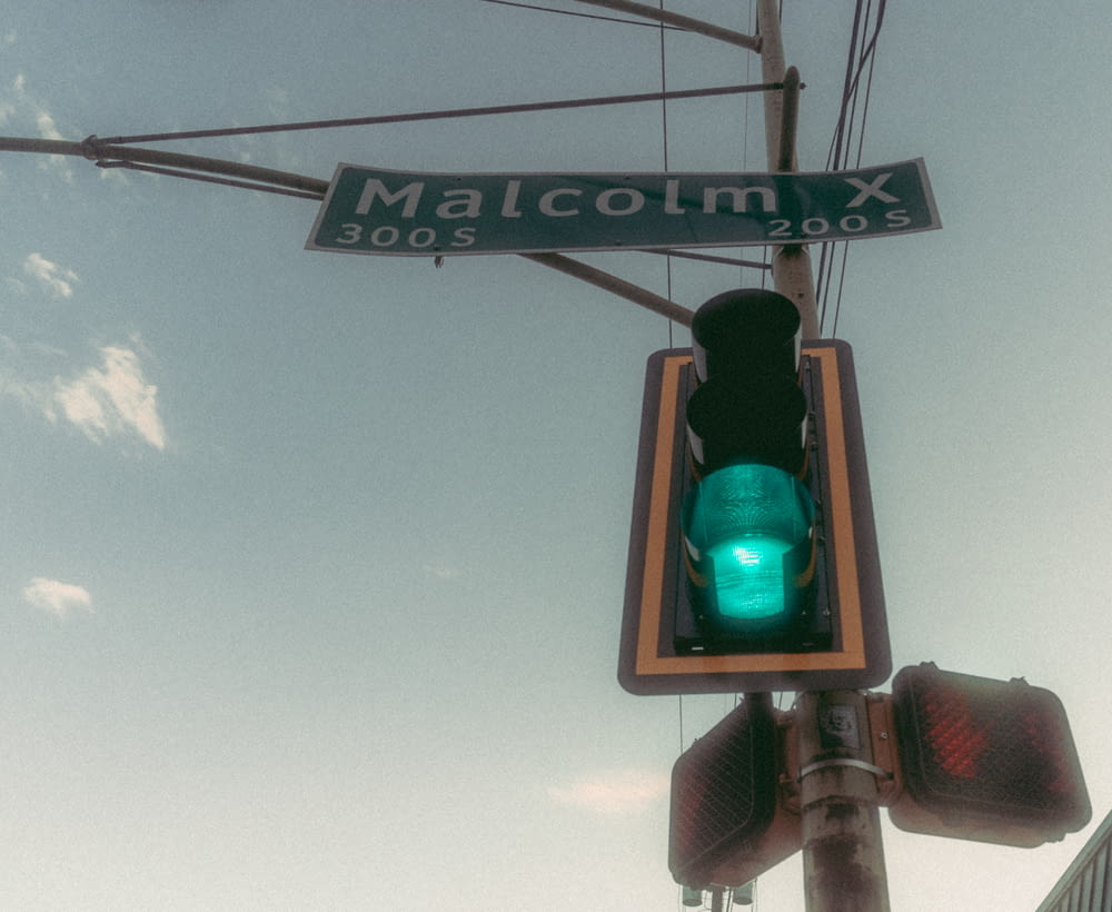 a traffic light with a green light underneath it