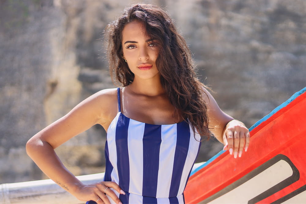 woman in blue and white stripe tank top
