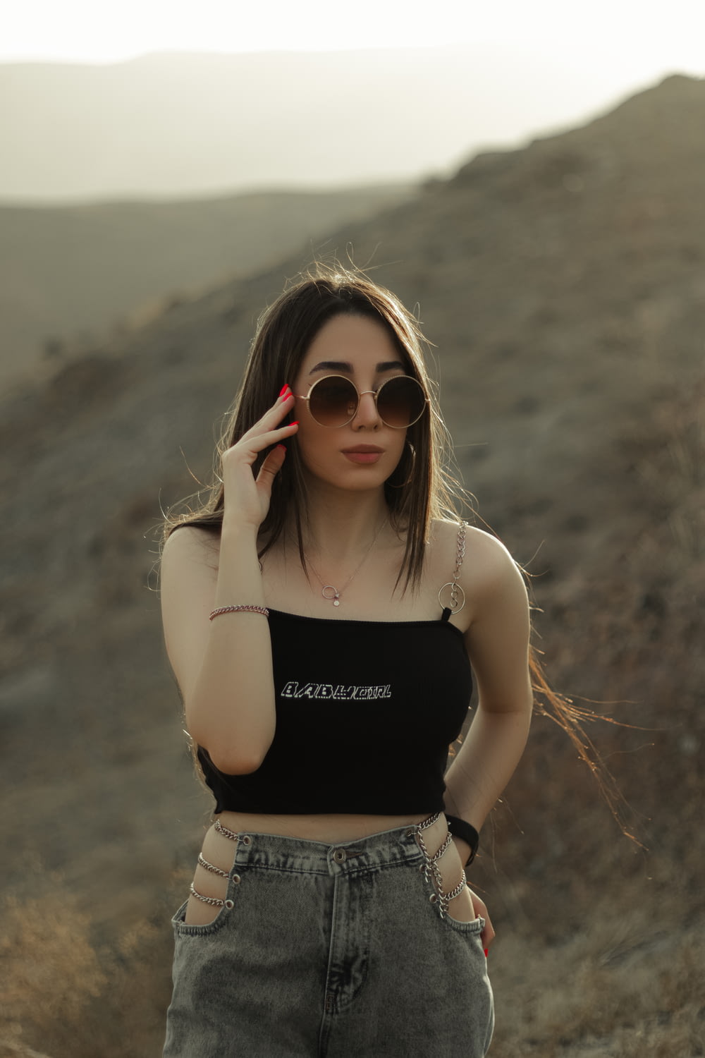 woman in black tank top and brown sunglasses