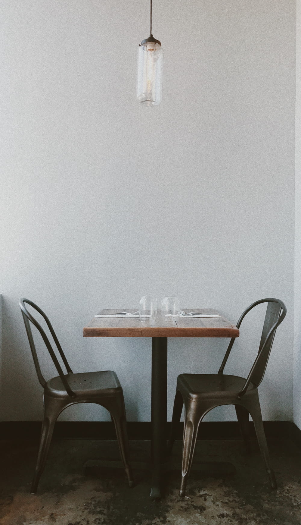 white and brown wooden table with chairs