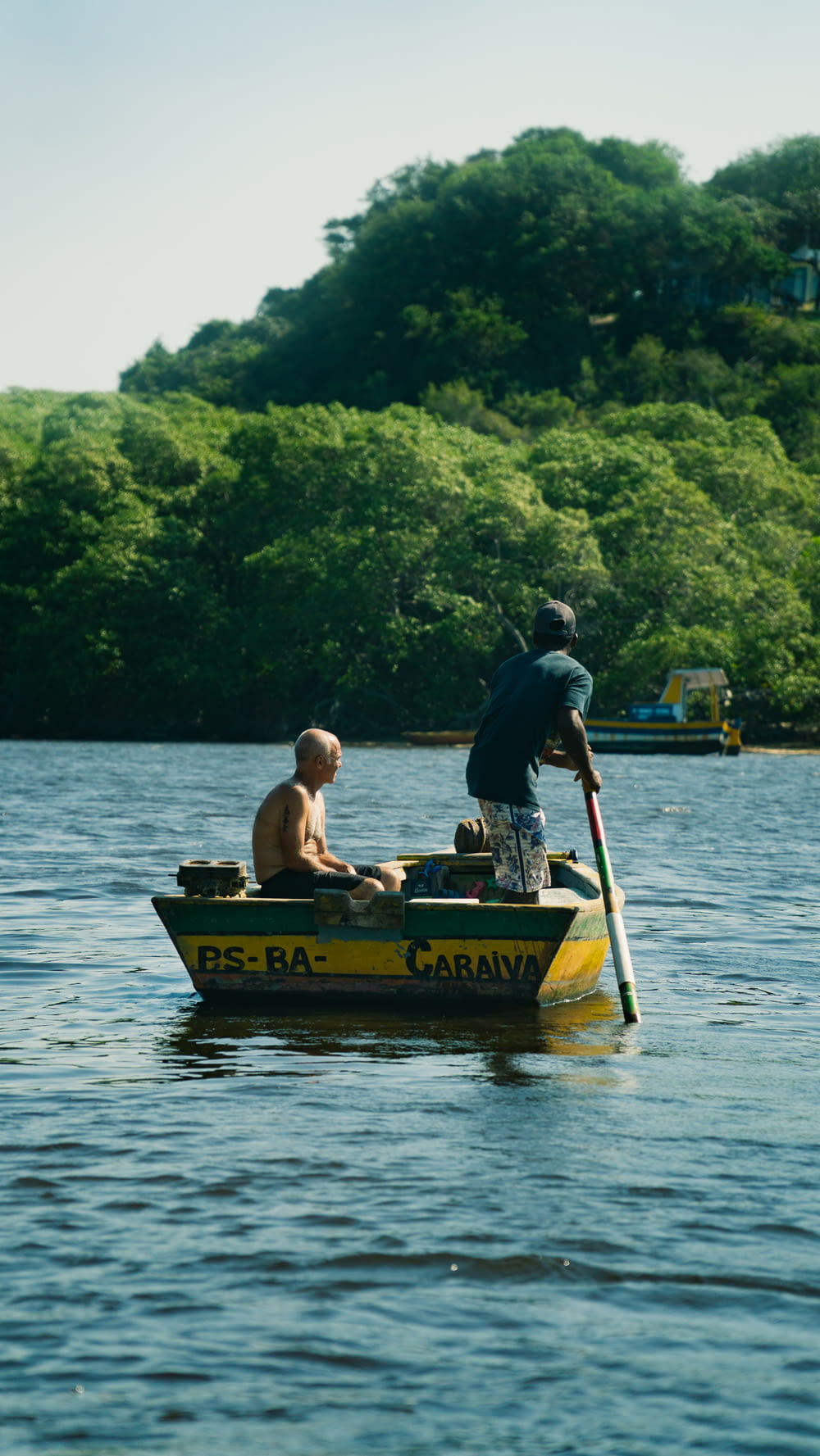 a man and a boy are in a small boat