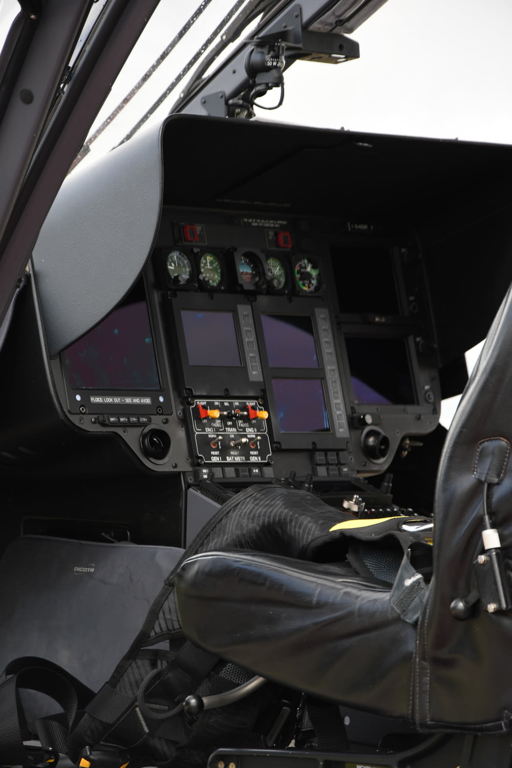 the cockpit of a small plane with the controls on