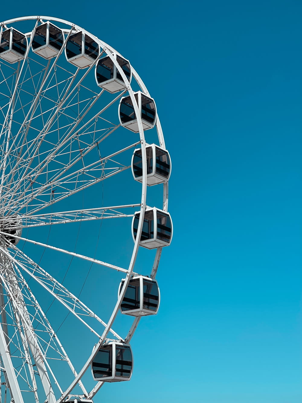 a large white ferris wheel on a clear day