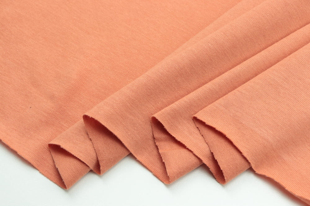 a close up of a plain orange fabric
