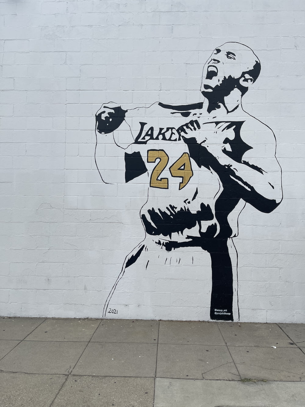 a mural of a man holding a baseball bat