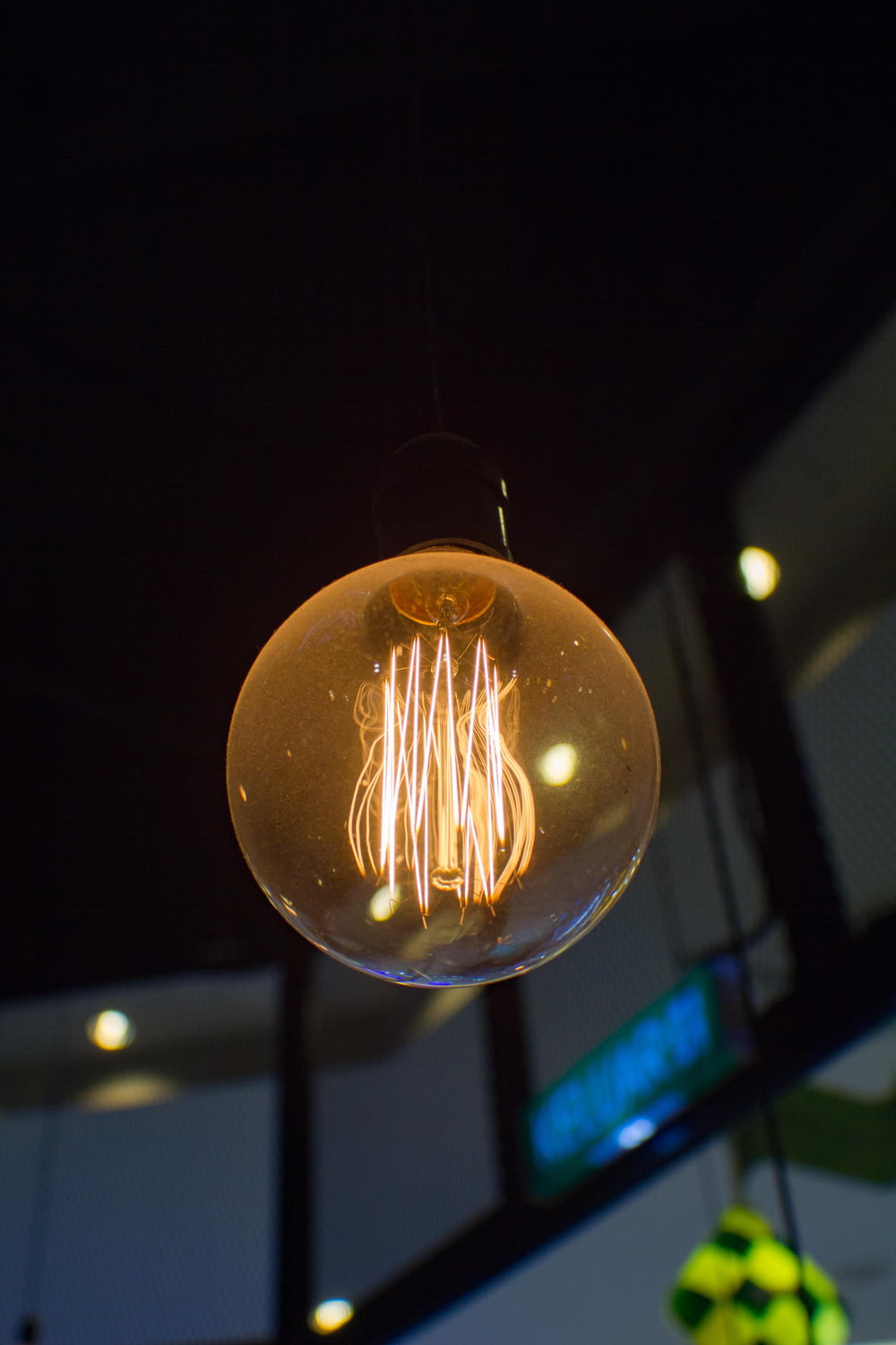 a light bulb hanging from a ceiling in a building