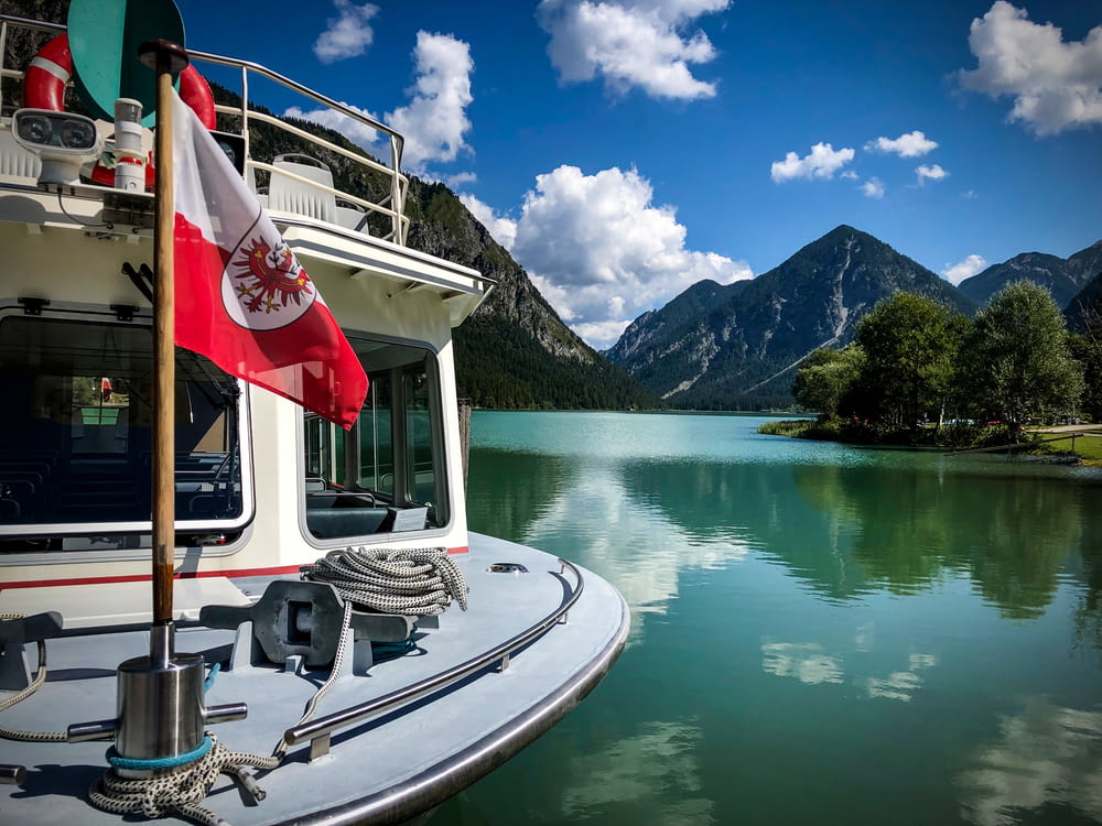 a boat with a canadian flag on the front of it