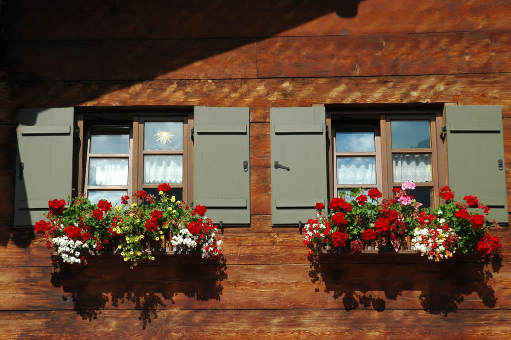 a couple of flower boxes sitting on the side of a building