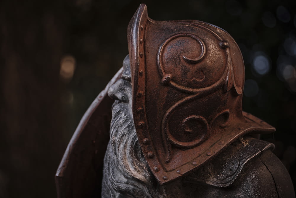 a close up of a helmet on a statue
