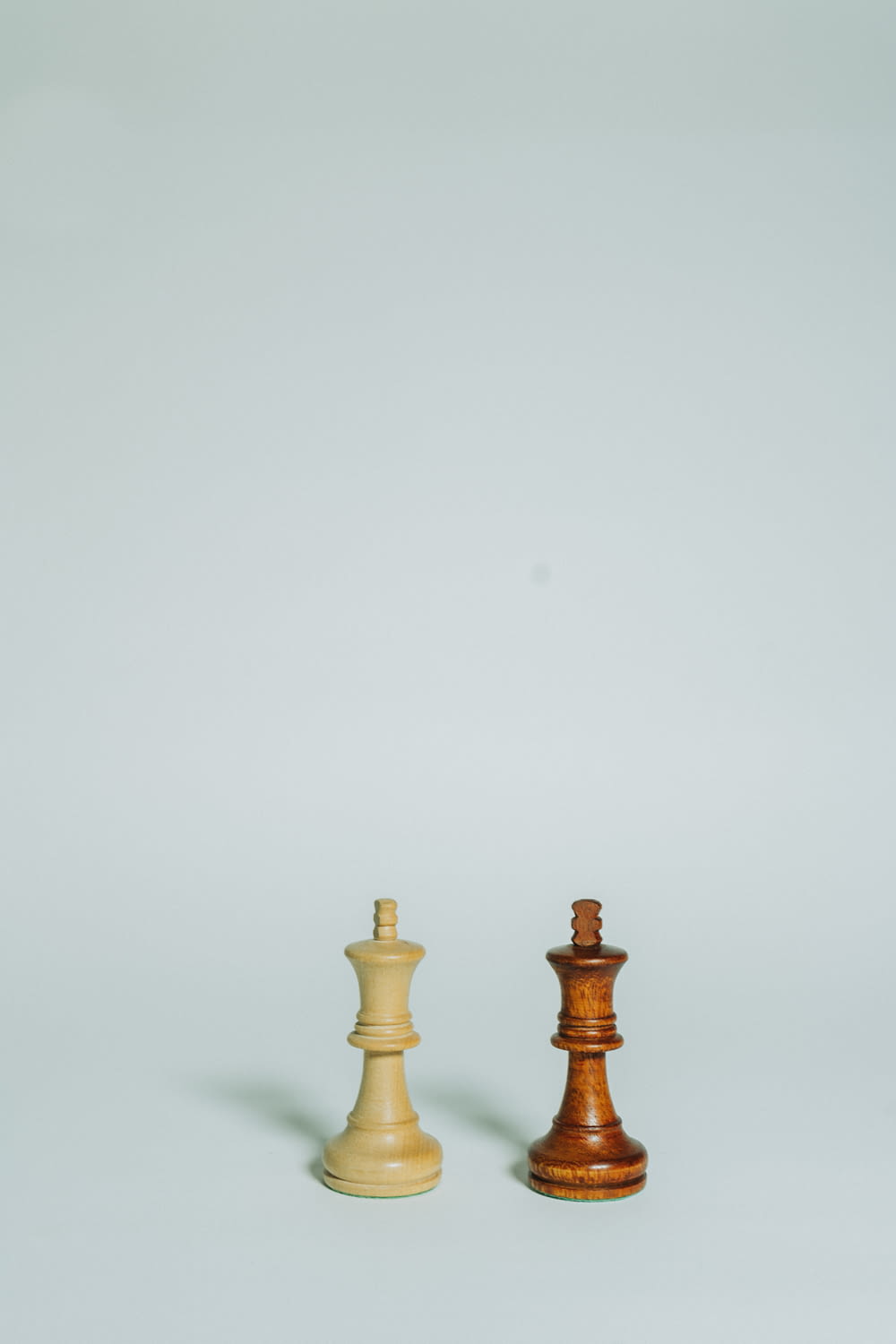 a wooden chess piece next to a wooden chess piece
