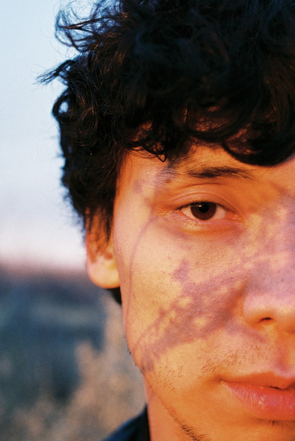 a close up of a person with freckles on his face