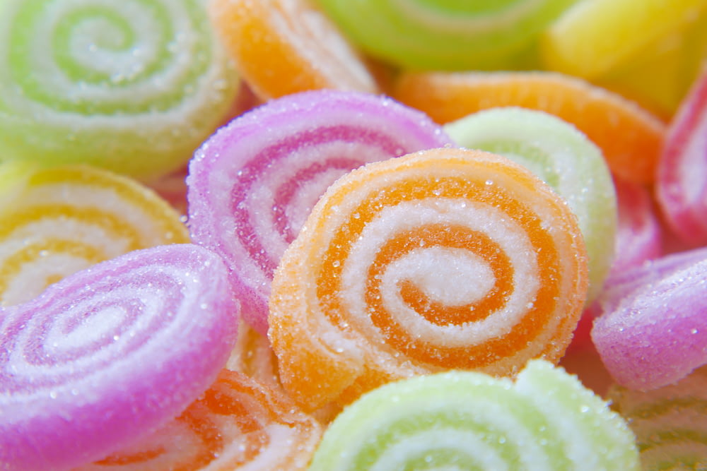 a close up of a pile of colorful candies