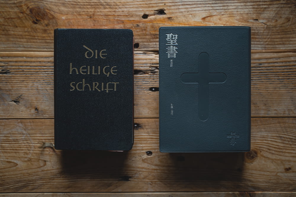a black book with a cross on it