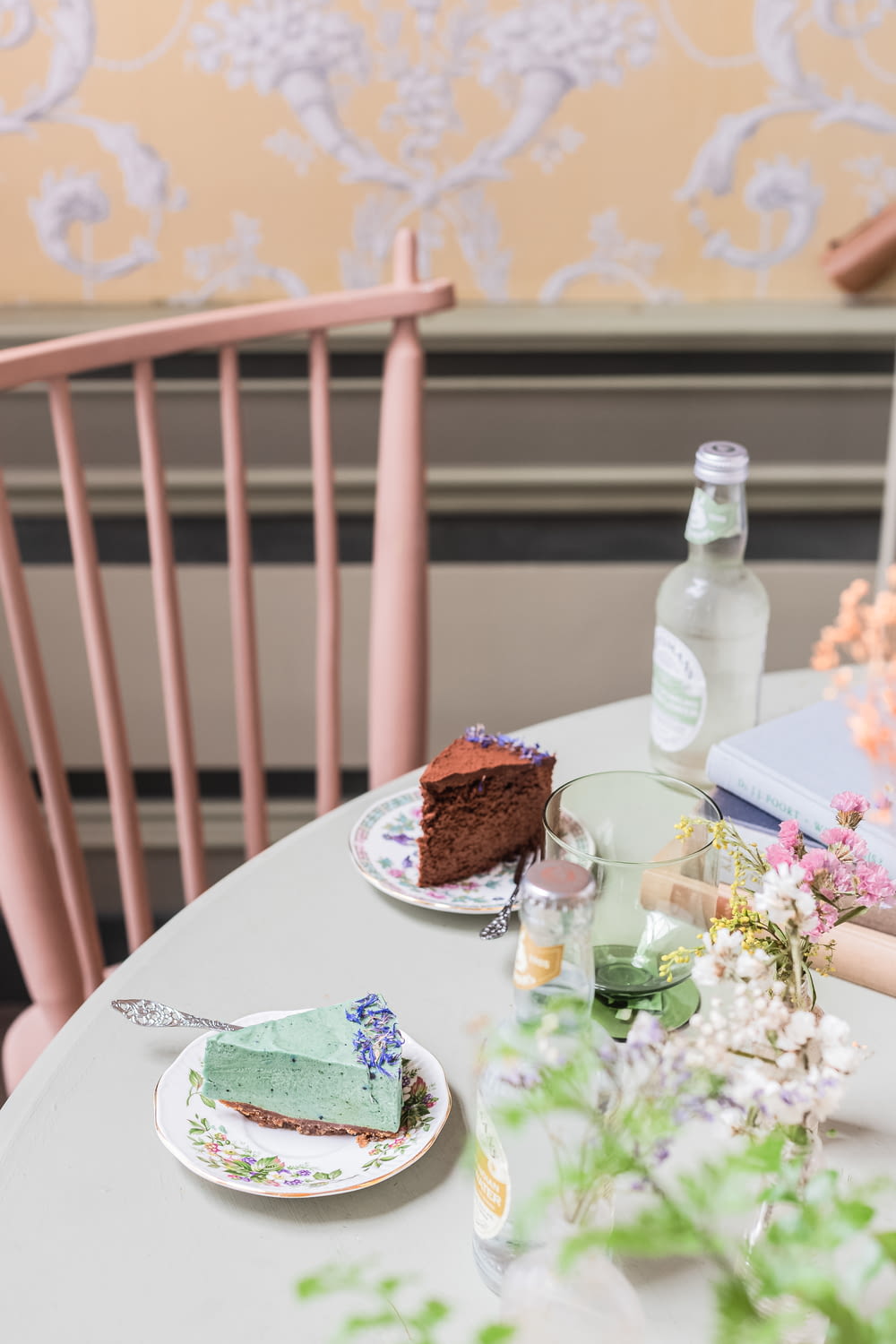 a white table topped with a slice of cake