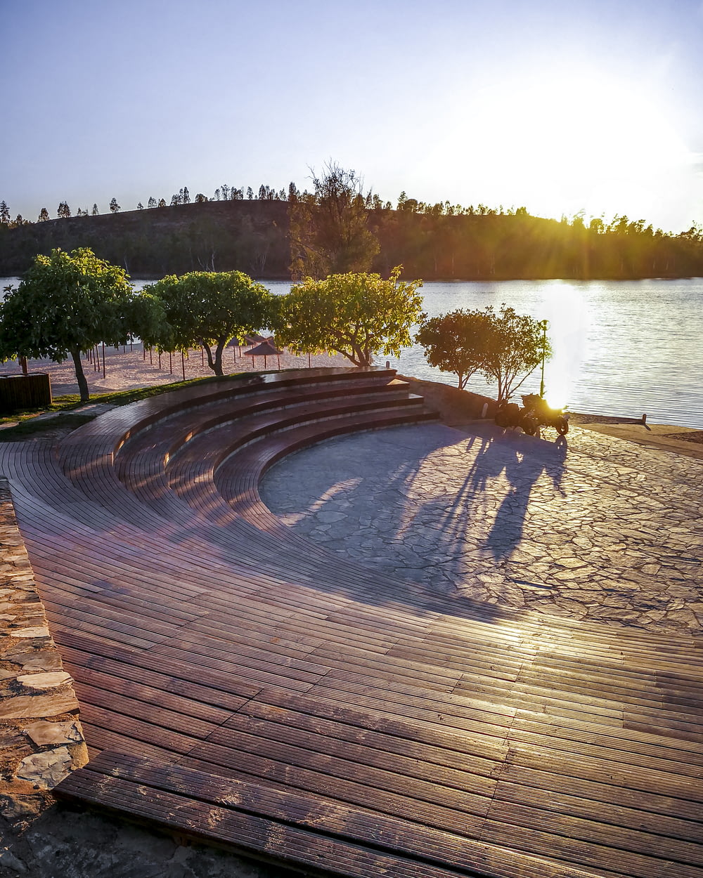 a wooden deck with a view of a body of water