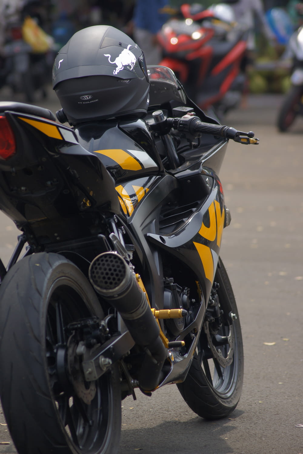 a yellow and black motorcycle parked on a street