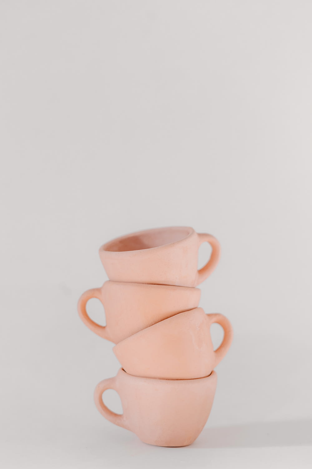 a stack of pink cups sitting on top of each other