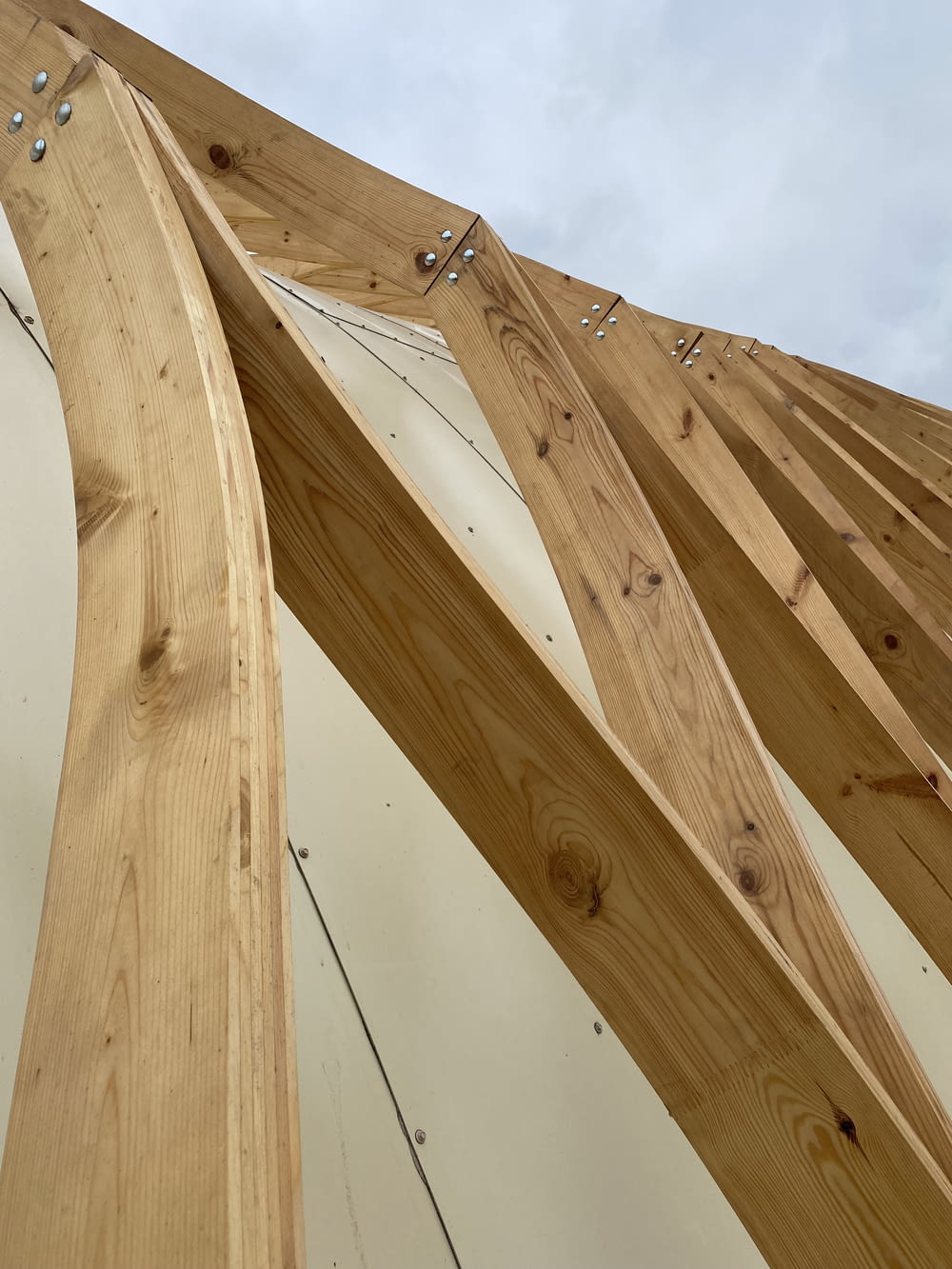 a close up of a wooden structure with a sky background