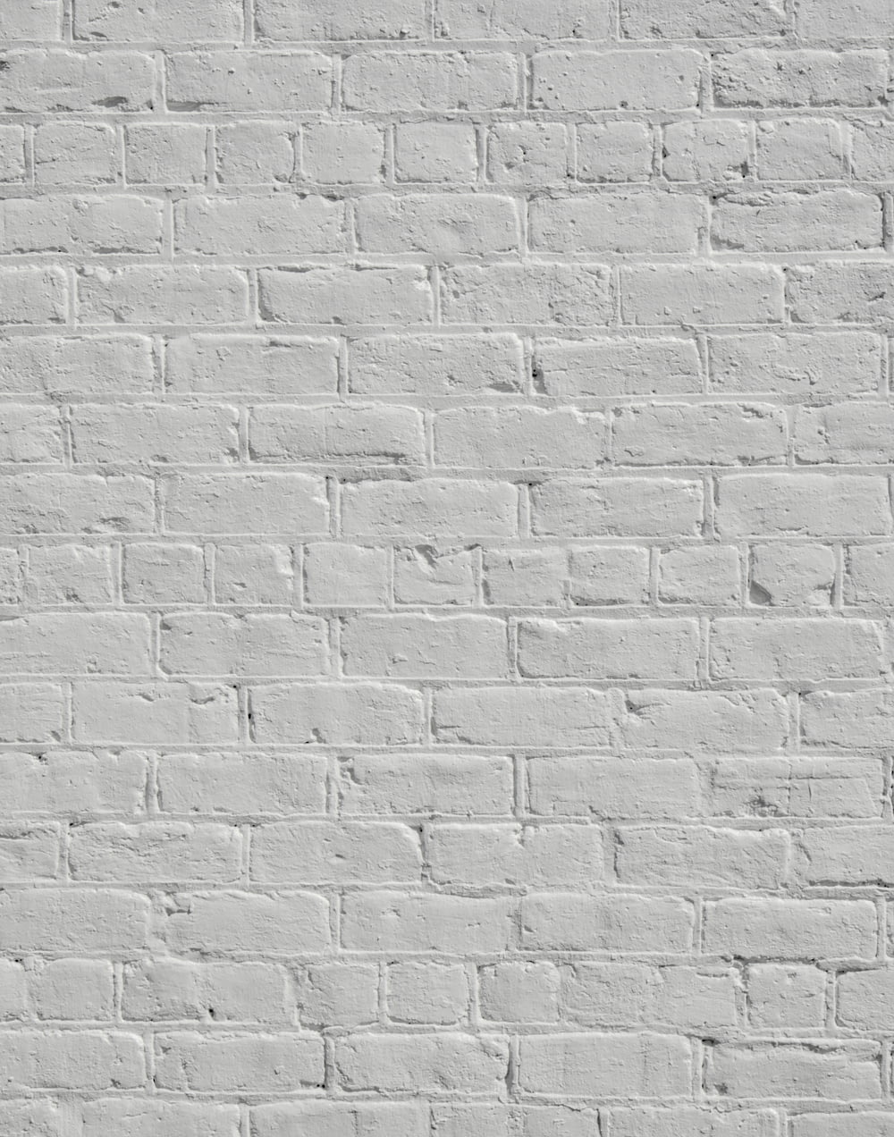 eine weiße Ziegelmauer ohne Mörtel oder Mörtel
