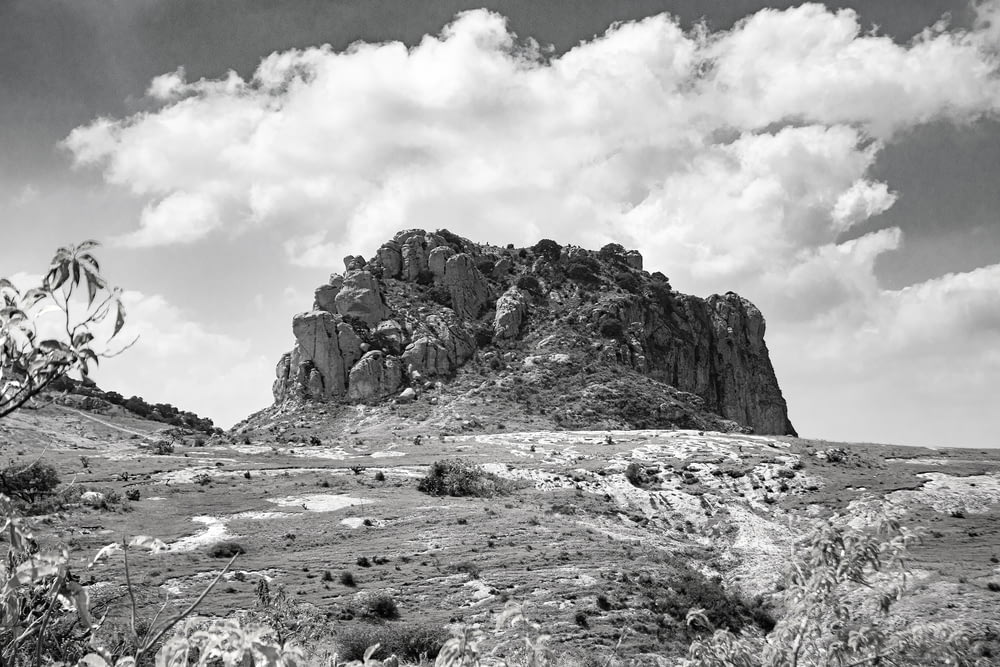 a black and white photo of a rocky outcropping