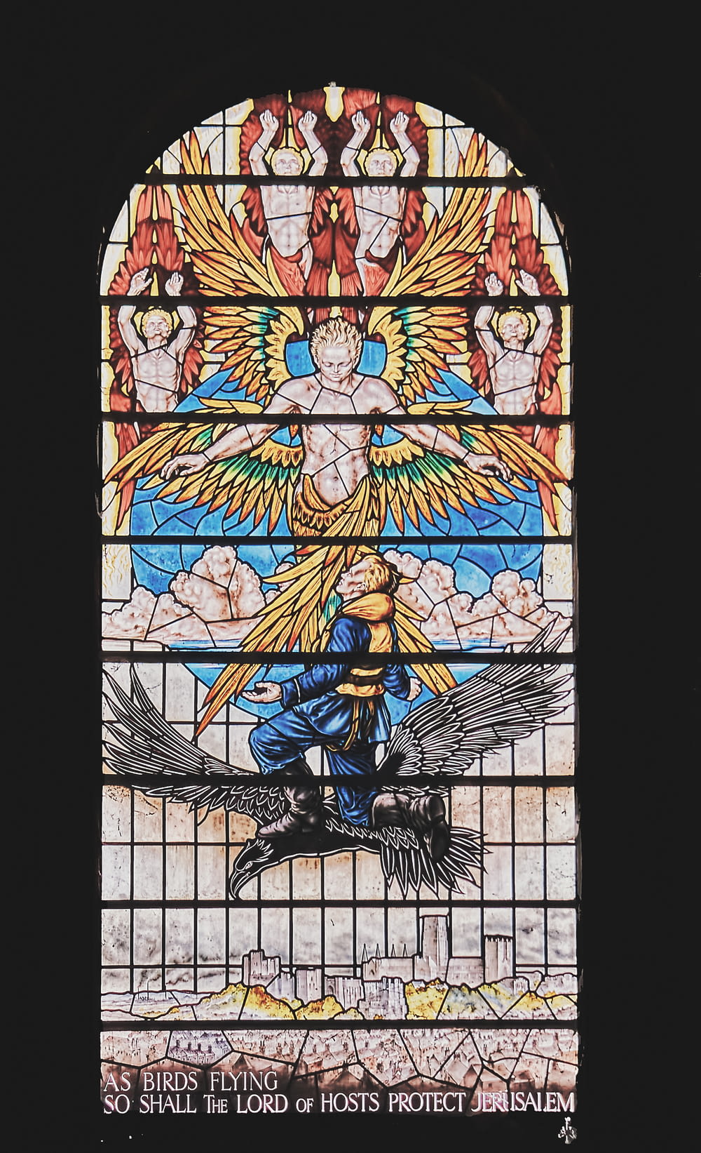 a stained glass window with an angel on it